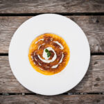 Risotto con zucca, provolone e polvere di liquirizia