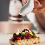 Bruschetta con polpo, pomodorini, puntarelle e olive con maionese